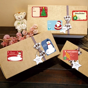 Christmas gift tags with Santa and snowman patterns on brown gift boxes for party decor