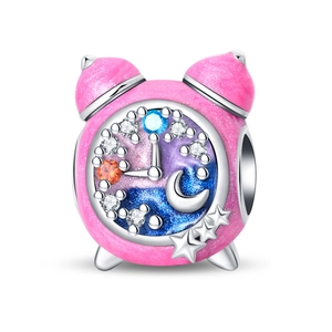 Detailed close-up of pink enamel alarm clock charm with star dial and zircon stones