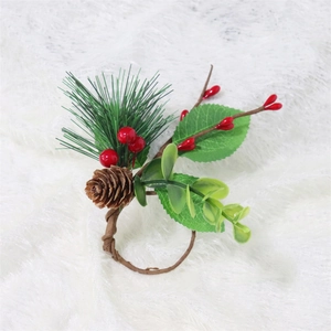 Detail of Christmas napkin ring featuring red berries, pine needles and a natural pine cone