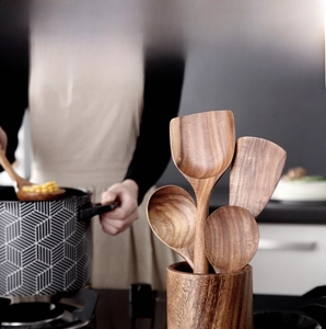 Detailed close-up of a 5-piece acacia wood kitchen utensil set with storage holder
