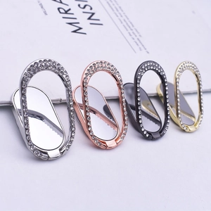 Oval rhinestone phone ring holder in silver, rose gold, black, and gold metal finishes