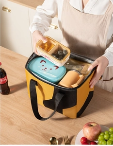 Spacious insulated lunch bag with thick aluminum foil lining showing food containers