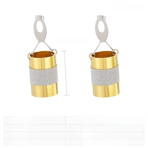 Detail of two-tone stainless steel drop earrings with matte sandblasted texture band