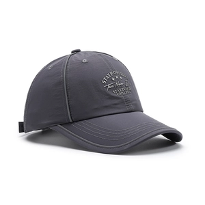 Dark grey nylon baseball cap with white star embroidery and wide brim shown from an angle