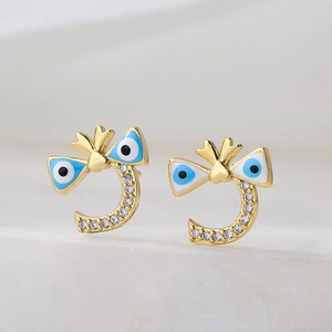 Irregular geometric blue evil eye stud earrings with gold bow and sparkling rhinestones