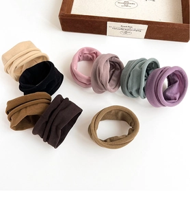 Flat lay of eight multi-color high elastic morandi hair ties on a white surface