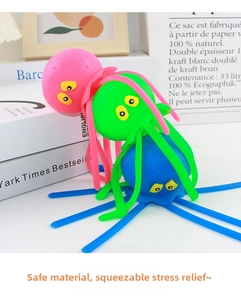 Close-up of three colorful silicone octopus squeeze toys in pink, green, and blue