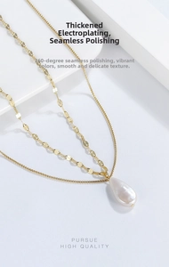 Detail view of double-layered gold chain with white baroque teardrop pearl pendant
