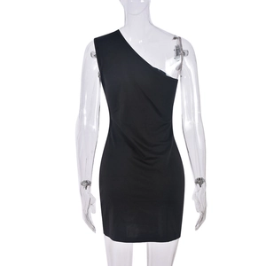 Detail of black off-the-shoulder mini dress with rhinestone bow and side slit design