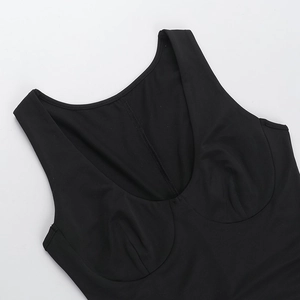 Detail view of U-neckline and stitching on black slim fit ruched strap dress