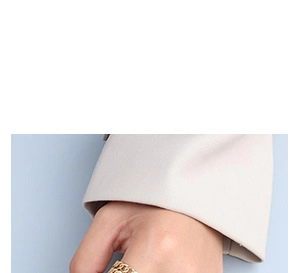 Close-up of a 18K gold plated titanium steel chain link ring on finger, fashion jewelry