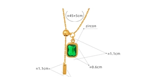 Detailed view of emerald zircon square pendant and adjustable gold tassel chain
