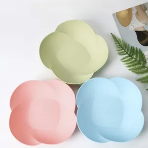 Three petal-shaped fruit plates in pastel macaron colors with matte finish for snacks