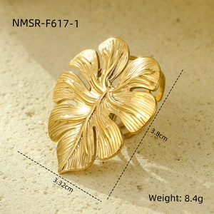 Detail view of a gold monstera leaf ring showing size 3.8cm and 8.4g weight specs