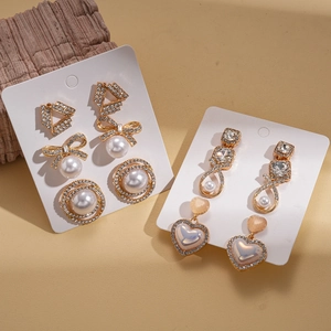 Set of 12 vintage-style earrings with pearls, rhinestones, and hearts in gold plating