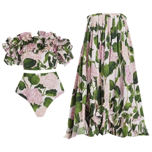 Detailed flat lay of ruffle bandeau top and maxi skirt with pink hydrangea floral print