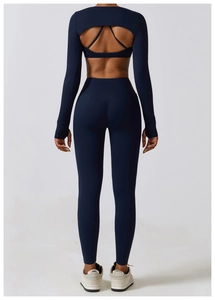 Detail view of the back cutout design on this navy blue women's yoga activewear set