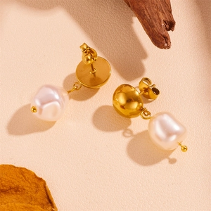 18K gold plated stainless steel earrings with baroque pearls on a natural background