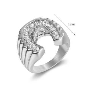 Macro shot of silver horseshoe ring with horse head relief and zircon stones, 19mm wide