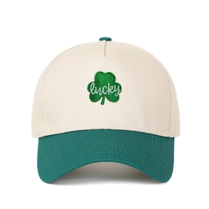 Two-tone trucker hat in beige and green featuring clover and lucky embroidery detail
