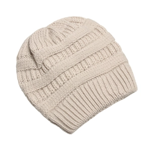 Beige chunky knit winter beanie for women with warm ribbed texture and ribbed cuff