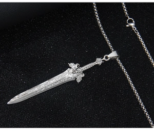 Macro shot of silver sword pendant with intricate lion handle carvings and metal chain