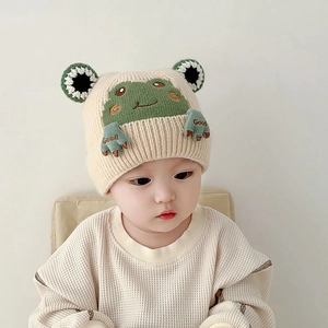Beige knitted baby winter hat with cute green frog 3D eyes and ear protection