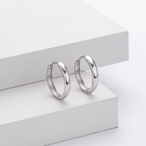 Macro shot of polished S925 sterling silver hoop earrings with a mirror finish