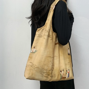 Detail of vintage canvas tote bag featuring traditional Chinese landscape painting