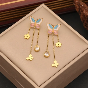 Golden butterfly earrings with blue pink enamel wings and dangling tassel charms