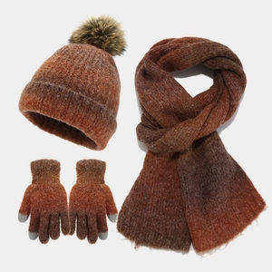 Detail of three-piece knit set with tie-dye brown orange gradient beanie scarf and gloves