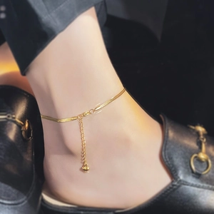Minimalist gold snake chain anklet for women with heart pendant on ankle