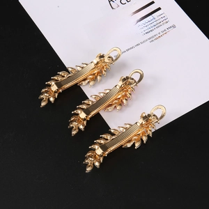 Three-piece gold feather leaf hair clips with rhinestone accents for women in retro style
