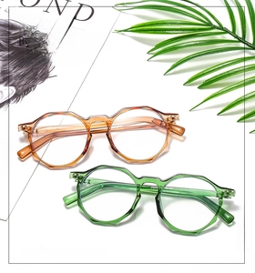 Detail view of stylish amber and green geometric frames with durable metal hinges