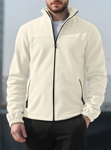 Close-up of cream polar fleece jacket showing standing collar and front zipper detail