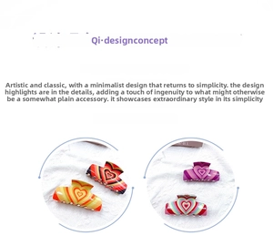 Detail of four colorful acrylic heart hair claws with durable metal springs