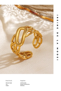 Detail of 18K gold plated hollow oval ring with elegant water ripple shadow on linen