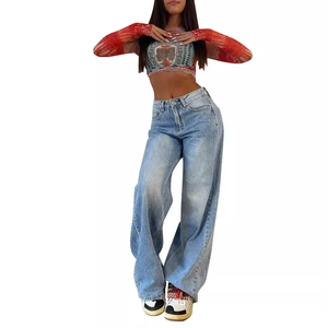 Women's vintage high waist wide leg jeans paired with a floral long sleeve crop top