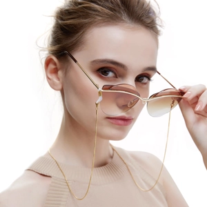 Modern 24k gold-plated snake chain for sunglasses with brown gradient lenses