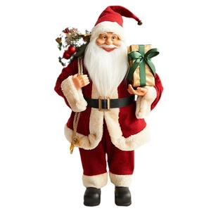 Classic Santa Claus figurine with red velvet suit holding a green gift box and sack