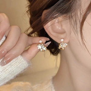 Elegant rocking horse stud earrings with gold plating, white enamel and pearl accents