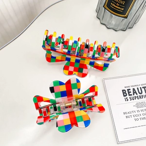 Set of two colorful checkerboard hair claws in flower shape with high-gloss finish
