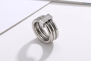 Detail of silver multi-layer steel ring with sparkling double-row rhinestone buckle