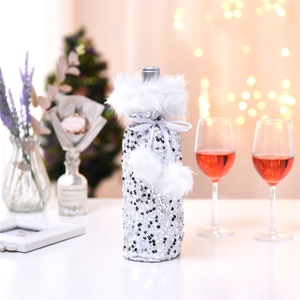 Silver sequin Christmas wine bottle cover with white faux fur trim and velvet pom-poms