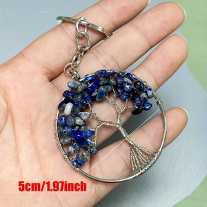 Handmade tree of life keychain featuring blue lapis stones and silver wire wrap detail