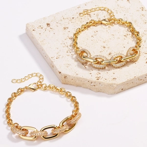 Detailed macro view of gold-plated hip hop bracelet with sparkling pave zircon settings
