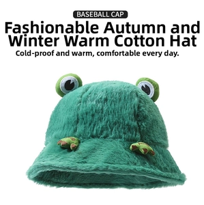 Close-up of fluffy green plush frog hat texture with soft faux fur and cute 3D frog eyes