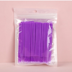 Detailed view of disposable purple micro brushes for eyelash extension in a clear bag