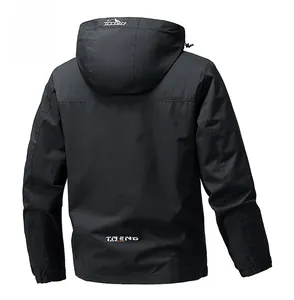 Rear view detail of black hooded windbreaker jacket with TREND lettering and logo