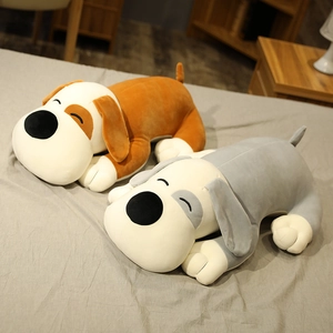 Detail of plush puppy dog pillow shells in brown and grey colors for home decor